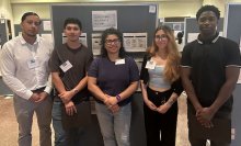 five students pose