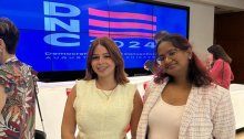 two female students pose at convention